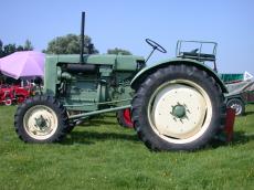 tractor show truck big giant wheel wheels green metal plate plates plating