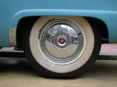 tire shiny 50s fifties car blue green round old oldsmobile tin reflection