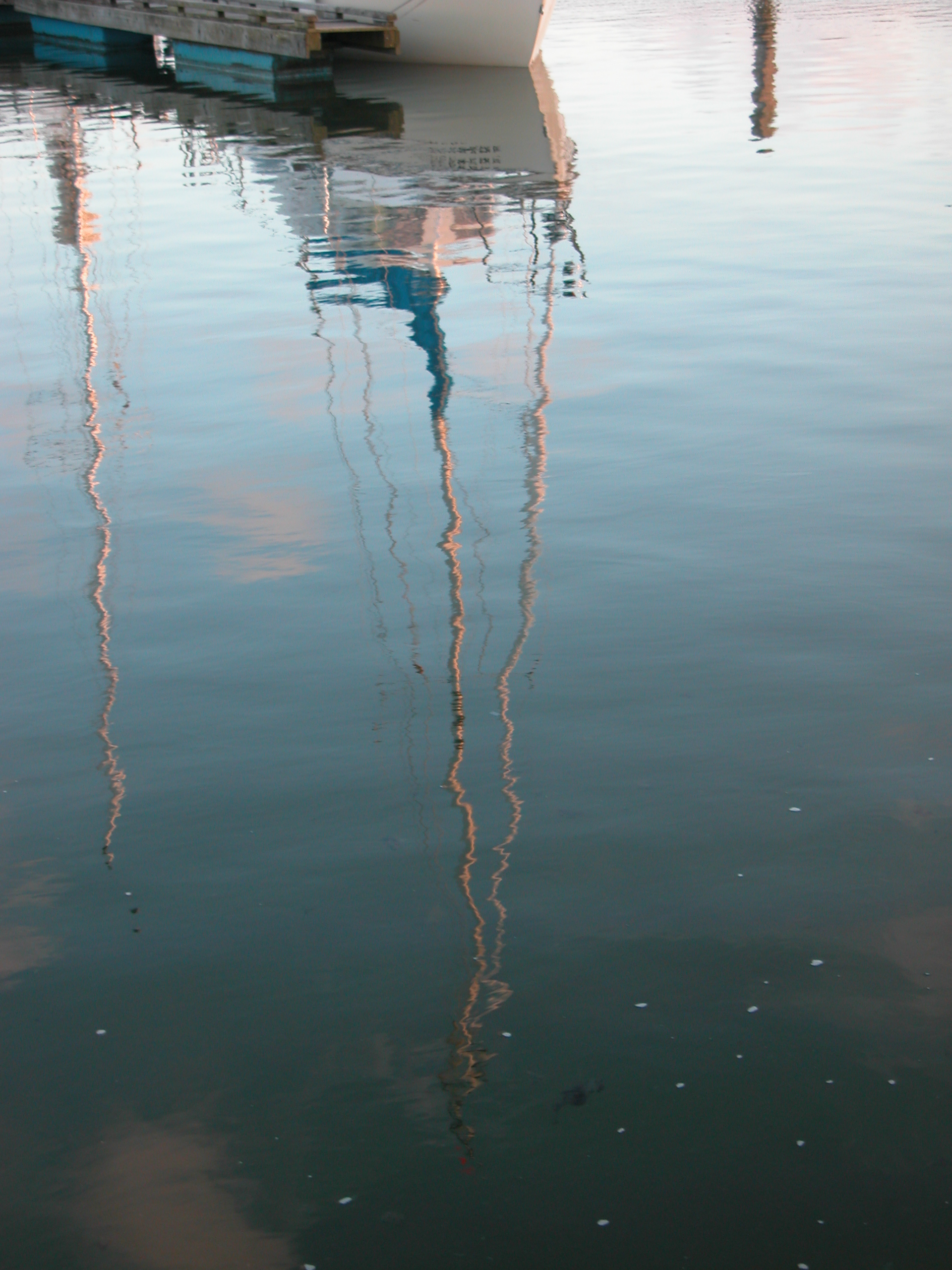 boat mast reflecting reflection water