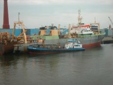 nelli freighter ship boat dock docks rusted old cargoship cargo transporting nelli tug tugboat