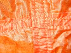 orange weave wove fabrics texture seam seams seamed nylon synthetic