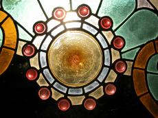 yellow glass circle stained glass red green spheres