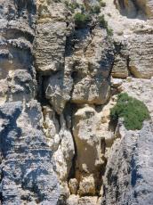 rock wall edge sand colour grey stone