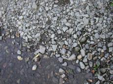 pebbles grey in water shore