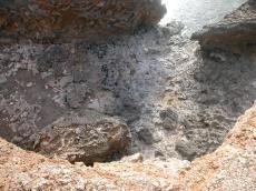 cliff cliffs craggy sheer steep drop gravel gravelly rocks rocky coast coastal coastline warm