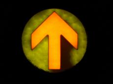 light sign arrow pointing point up yellow exit green black round