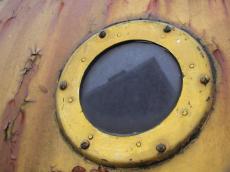 ship porthole window round circle rivet rivets metallic yellow screws