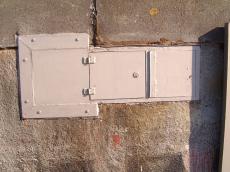 maartent hinches white painted metal hatch door lock wall