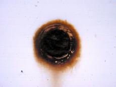 rust metal screw black hole 