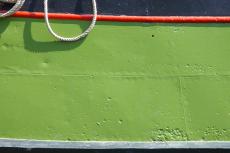 metal steel ship hull painted dented