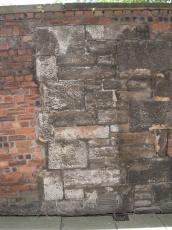 wall backstreet back street alley alleyway gutter urban setting old dirty red