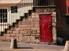 stairs stones bricks wall red door wood old medieval edinburgh