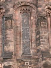 church high tall gothic window emblem emblems stones grey