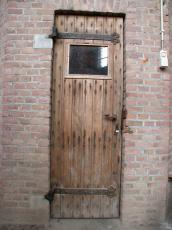 wooden door wood windiw planks stone wall bricks