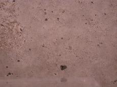 floor wall hard flat surface totally concrete slab of brown air bubbles