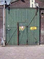 wood wooden shed door r2 brick wall green