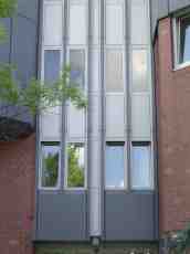 rigoletto office building block grey gray outside wall