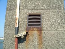 wall concrete brown hard straight drainpipe pipe drain grating rusting rainpipe