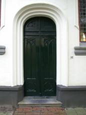 walls door doors entrance wood wooden green arch church churchdoor plaster