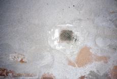 drain drainage hole in the floor little window barred