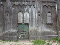old factory gotham city walls high bricks abandoned closed baorded up windows planks derilict