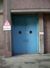 blue doors door double warning sign bricks architecture