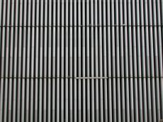 pipe pipes plastic heap bunch wall white grey long vertical stripe stripes
