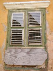 wall window sil yellow paint concrete glass closed